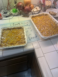 two trays of food on a counter top